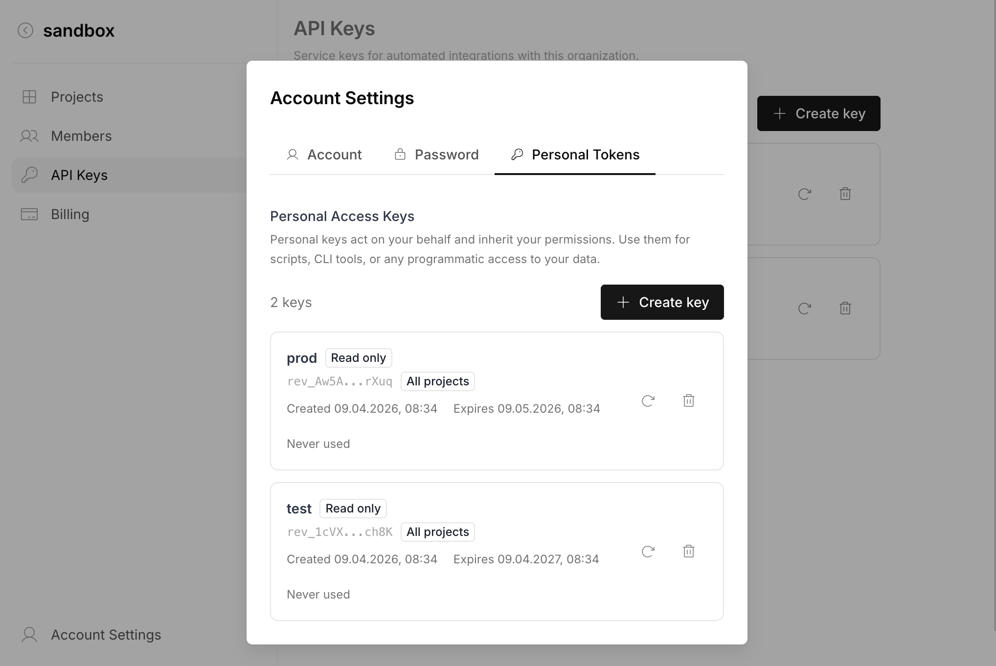 Account Settings — Personal Tokens tab with list of personal keys showing name, scope, expiration, and rotate/delete actions